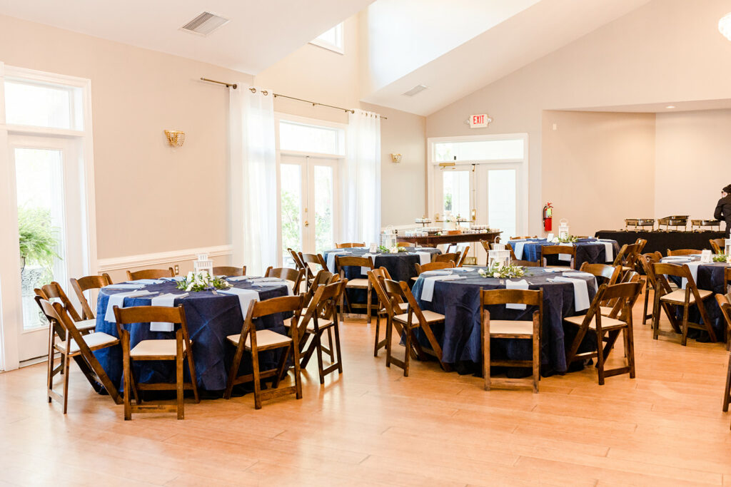 Blue linen on round tables inside the venue
